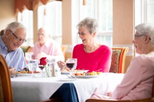 a group of seniors dine together